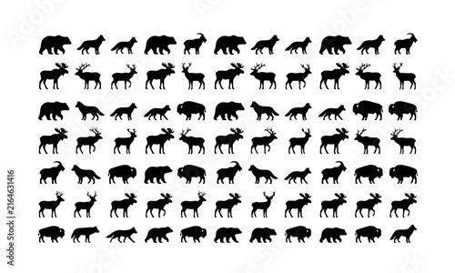 Set of black silhouettes of wild forest animals including bears moose deer wolves and mountain goats isolated on white background