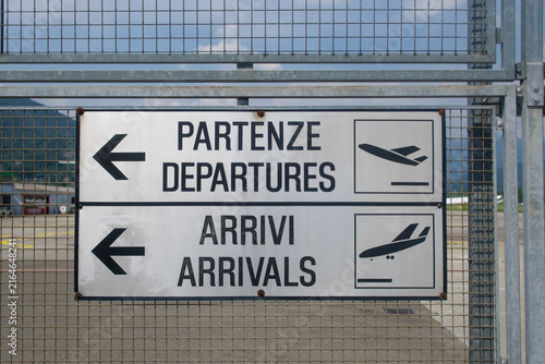 Airport departures and arrivals bilingual sign in Lugano Agno Switzerland