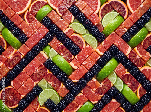 Elegant Diagonal Stripe Pattern of Sliced Citrus Fruits and Blackberries