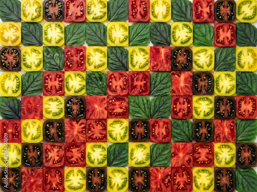 Checkerboard Tile Pattern of Sliced Tomatoes and Basil Leaves