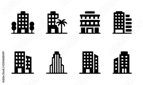Set of eight black silhouette representing various modern city buildings and office structures