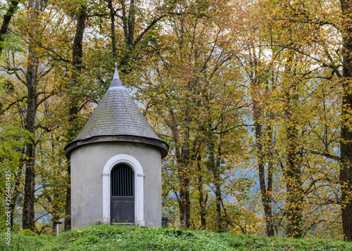 Small Woodland Shrine Surrounded By Autumn Forest Trees