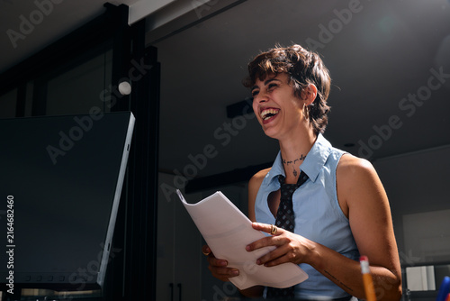 Laughing woman at business office meeting