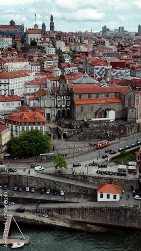 Aerial view of a historic tram by the Douro River in old Porto