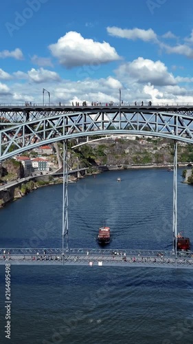 Aerial flight under the Dom Luis I Bridge over the Douro, Porto