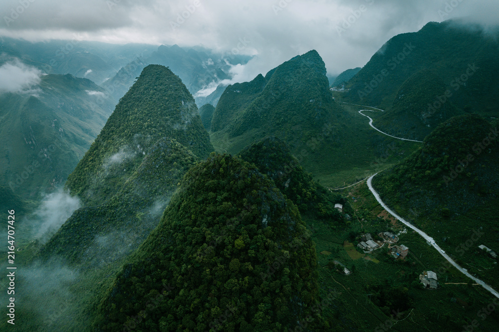 Obraz premium Aerial View of Misty Karst Mountains in Ha Giang Vietnam