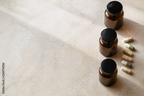 Three Bottles of Medicine Sitting on A Table with Visible and Natural