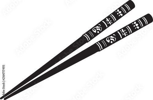Elegant black chopsticks adorned with intricate white patterns 