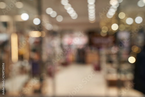 Blurred Retail Store Interior With Overhead Lights Aisles Indistinct Merchandise And Soft Bokeh In Shallow Depth Of Field Retail Environment.