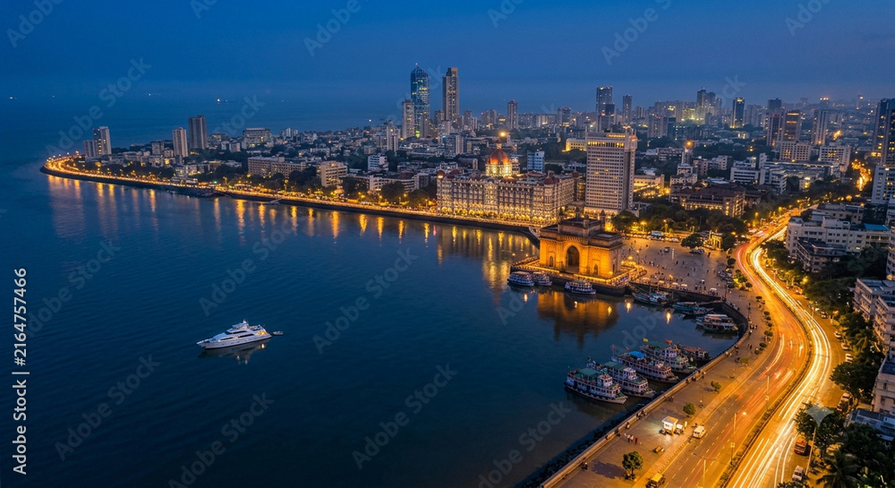 Fototapeta premium Panoramic Mumbai Skyline at Blue Hour with Illuminated Skyscrapers, Arabian Sea Horizon, Vibrant Evening Sky and Financial Capital Cityscape Maharashtra India