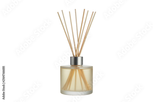 A glass reed diffuser bottle filled with scented oil and wooden sticks, isolated on a white background, for home fragrance, and spa decor