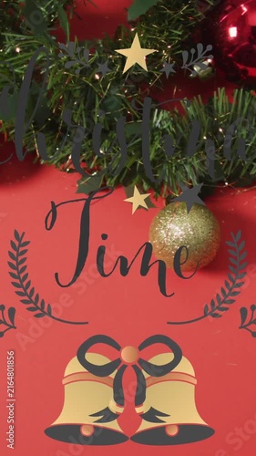 Vertical video: Frame shift starting green tinsel sliding and gold bauble centering over Time label
