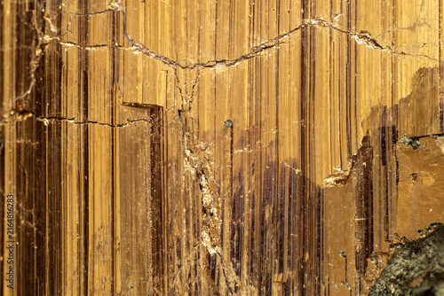 Konstfotografi Extreme macro detail of golden pyrite crystal showing metallic striations, fractures and natural mineral structure