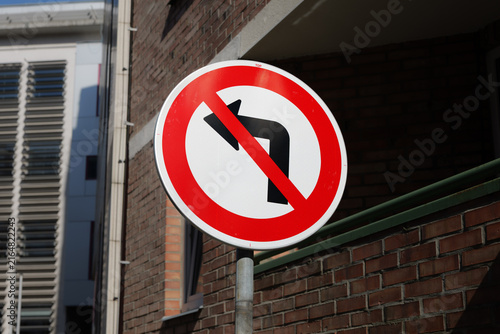 No left turn road sign in the Czech Republic. Prohibition symbol for road users in the city. Driving to the left is not allowed.