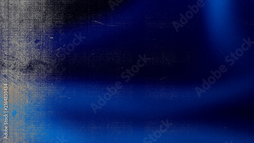 Dark blue abstract grunge background with vertical textured pattern and soft glowing light