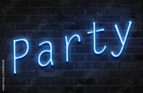 Neon Party sign on a brick wall