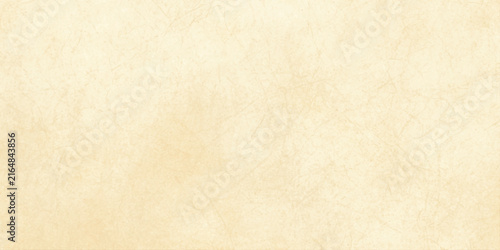 Фотография Beige parchment paper texture with subtle crinkled lines and faint grain