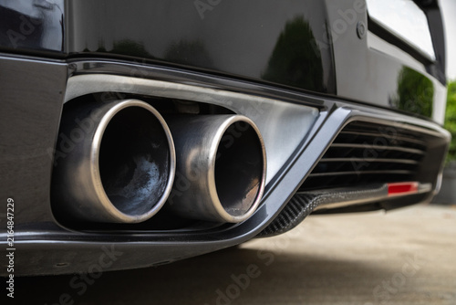 Quadro su tela Close-up of sports car dual exhaust pipes and rear bumper diffuser