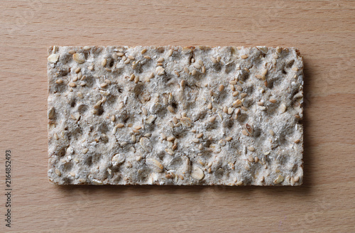 Slice of chrispbread on wooden background