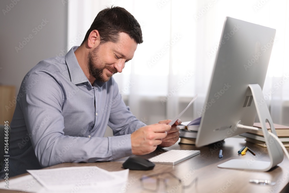 Fototapeta premium Writer working on his book in office