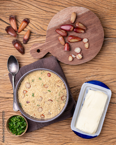 Fafora de pinhão, typical brazilian sidedish on a bowl over wooden table