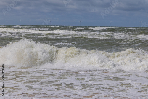 Photography Wild Sea Surf Breaking on a Sandy Beach Under a Stormy Sky