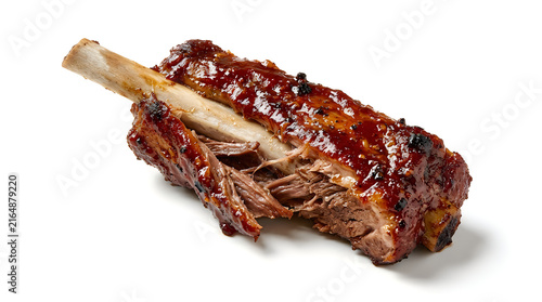 Grilled barbecue beef ribs with charred edges and sauce on bone