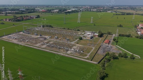 Aerial view of an electrical substation near Milan, showing high voltage equipment, transmission infrastructure