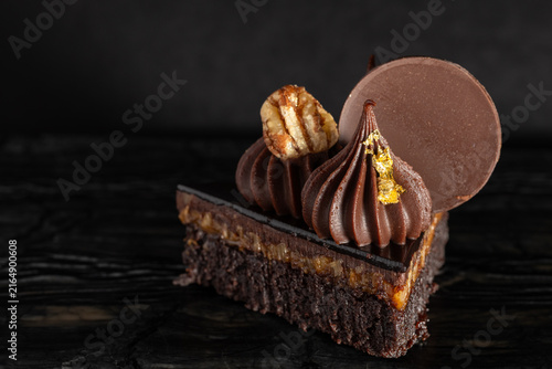 Close-Up of Rich Indulgent Chocolate Turtle Brownie Dessert on a Dark Background