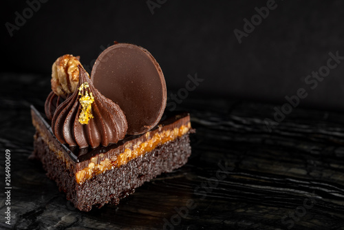 Close-Up of Rich Indulgent Chocolate Turtle Brownie Dessert on a Dark Background