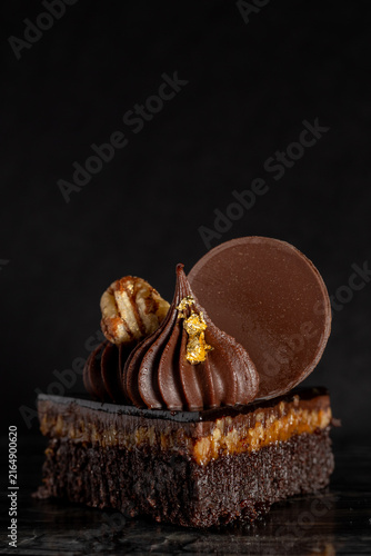 Close-Up of Rich Indulgent Chocolate Turtle Brownie Dessert on a Dark Background