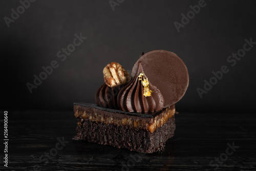 Close-Up of Rich Indulgent Chocolate Turtle Brownie Dessert on a Dark Background