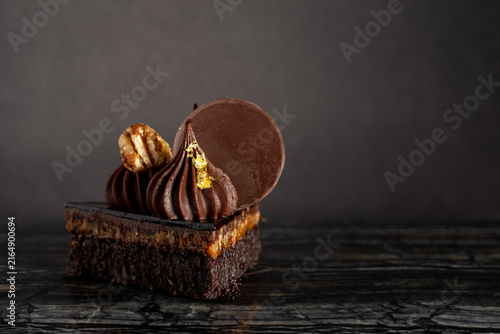 Close-Up of Rich Indulgent Chocolate Turtle Brownie Dessert on a Dark Background