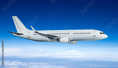 Photography White passenger jet airplane flying high in the clear blue sky over white clouds