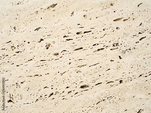 Detailed surface texture of travertine limestone stone with travertine limestone background