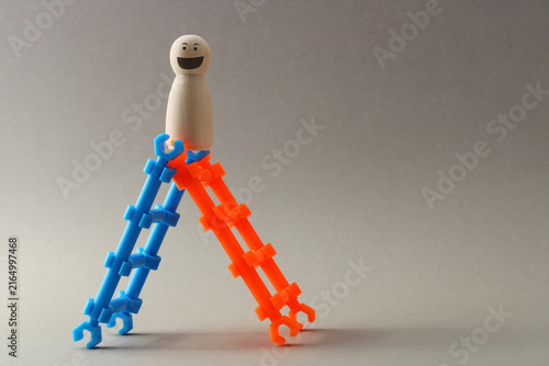 Konstfotografi Leader climbs using two ladders