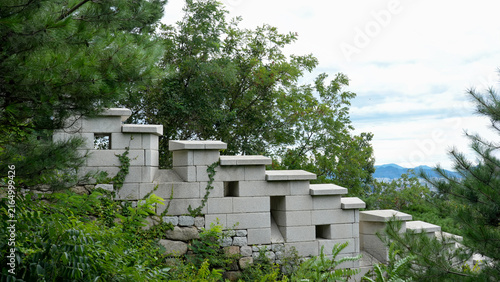 Hanyangdoseong (Seoul City Wall) in summer with lush green forest and historic stone pathway, South Korea
