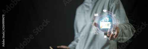 Digital wallet and online payment concept featuring  human using a smartphone with a futuristic financial interface. Represents mobile banking, digital payments,  fintech and cashless technology.