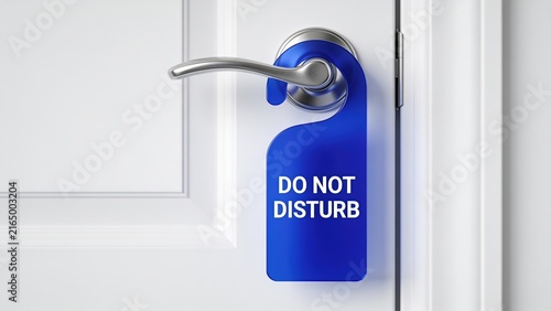 Blue Do Not Disturb Sign on White Hotel Door Handle