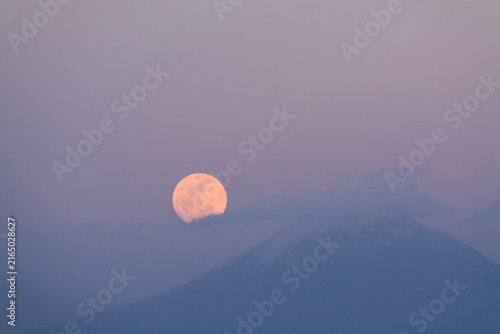 Full Pink Moon over a volcano