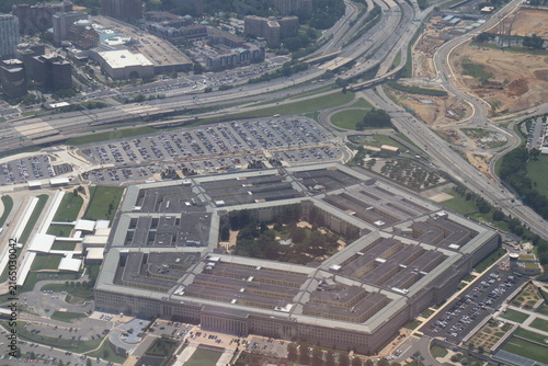 Aerial view of the Pentagon complex with surrounding roads, parking and greenery. g.
