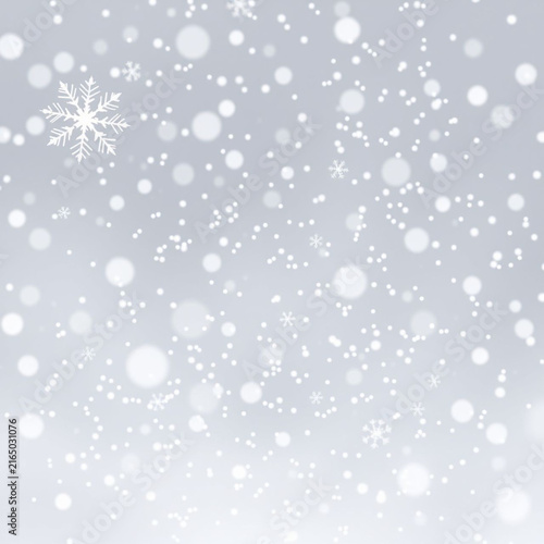 Falling snow background. Winter weather backdrop with white snowflakes and bokeh lights.