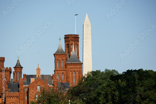Canvas Print Smithsonian Castle and museums on the National Mall with green lawn and Washington Monument in background, DC, USA