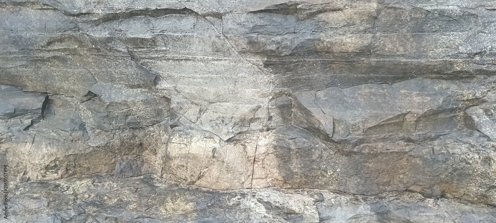Fototapeta premium High angle view of rocky coastal shoreline with rough stone formations