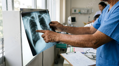 Healthcare Professional Examining Chest X-Ray in Hospital