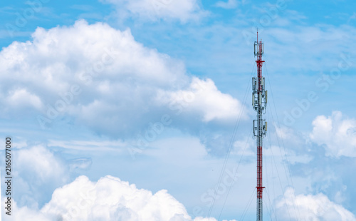 Bild auf Leinwand Cellular telecommunication tower with wireless antennas against dramatic blue sky