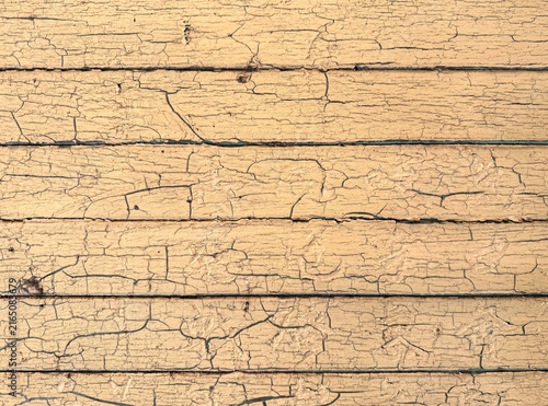 Cracked paint on a wall of wood planks
