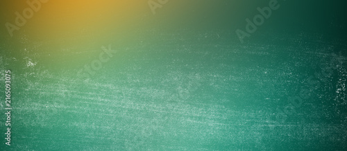 Gritty textured surface background with green teal tones and subtle golden light flare provides authentic vintage aesthetic for artistic photography overlays and print layouts.