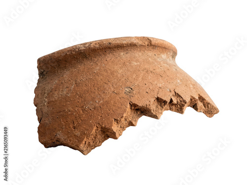 Terracotta pot fragment with jagged edges lies isolated on a white background.
