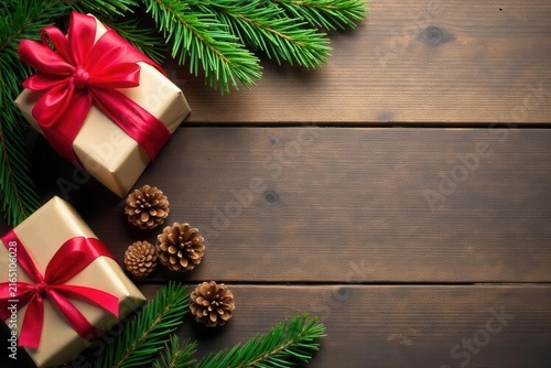 Rustic wooden table, wrapped gifts, pine cones, fir branches Ample copy space , background, gifts